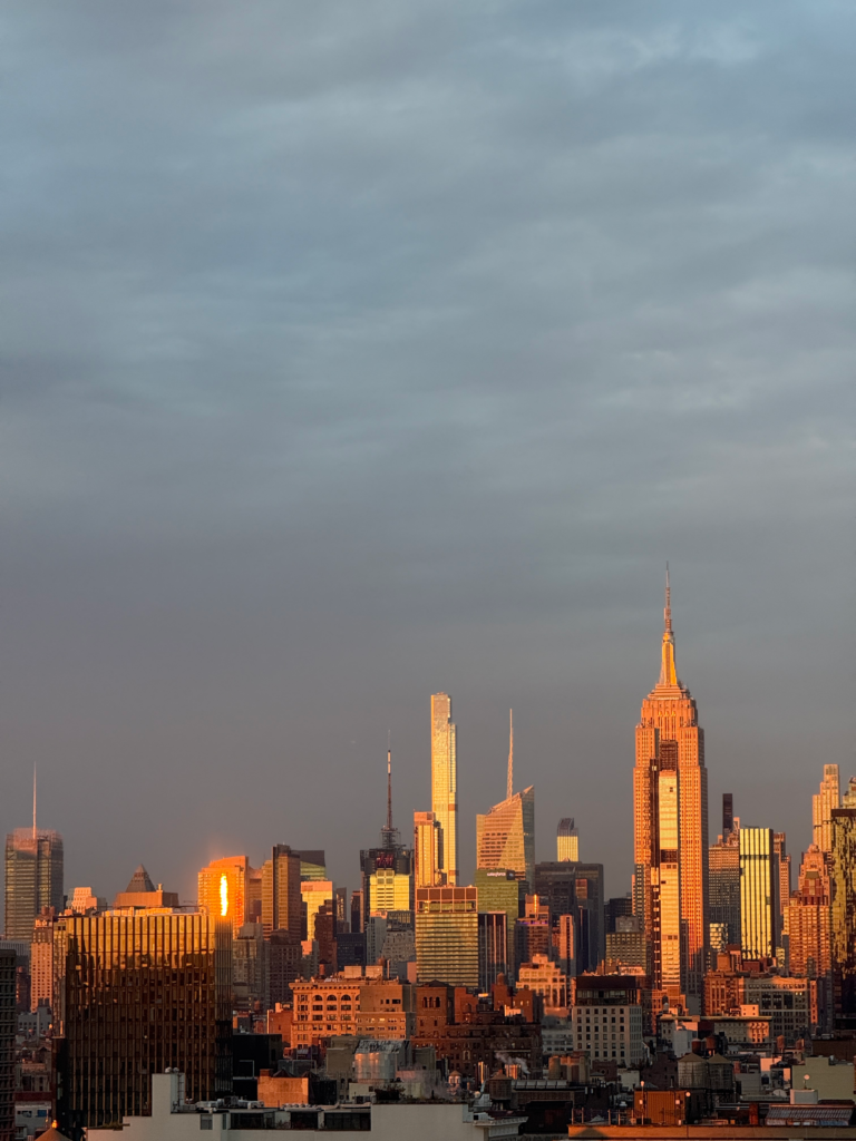 Manhattan skyline at sunset with the Empire State Building and Crysler Building